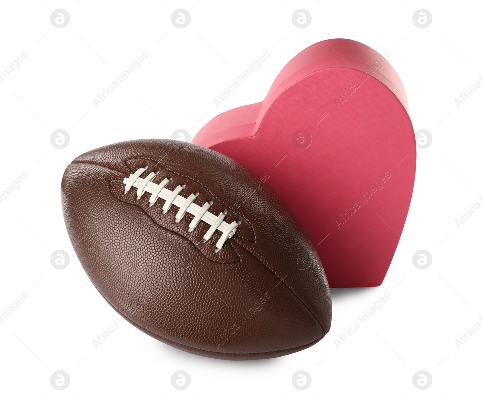 Photo of American football ball and heart box on white background