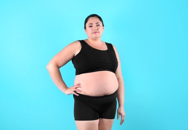 Fat woman on color background. Weight loss