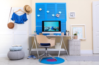 Photo of Home workplace with modern computer and desk in room