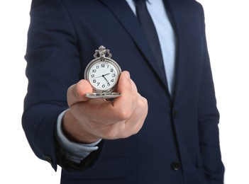 Photo of Businessman holding pocket watch on white background, closeup. Time management