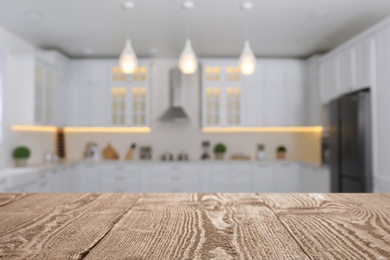 Image of Wooden table in light kitchen. Space for design