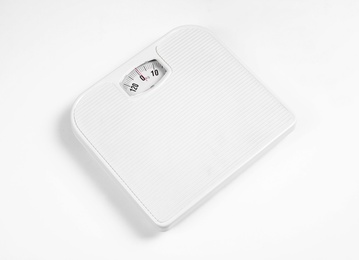 Photo of Modern scales isolated on white. Diet and weight loss