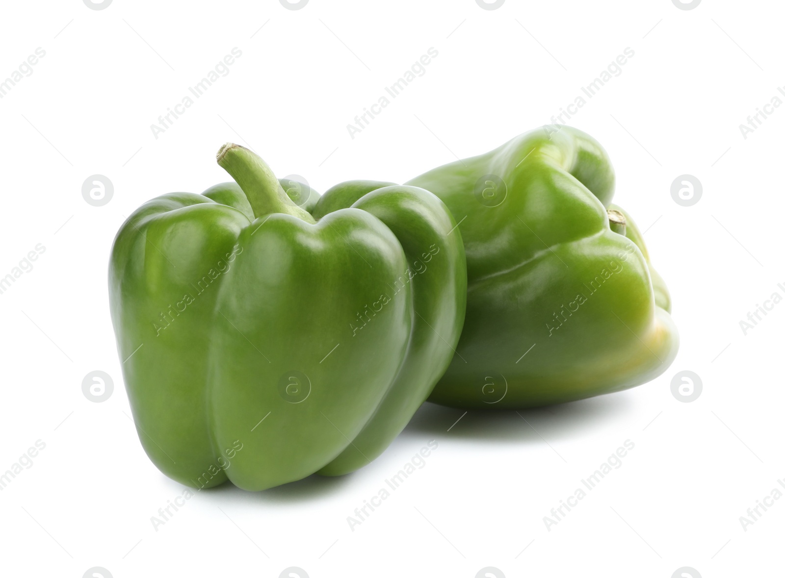 Photo of Fresh ripe green bell peppers isolated on white