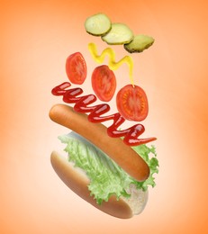 Hot dog ingredients in air on orange gradient background