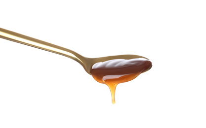 Photo of Salted caramel in spoon isolated on white