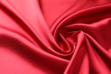 Texture of beautiful red silk fabric as background, closeup