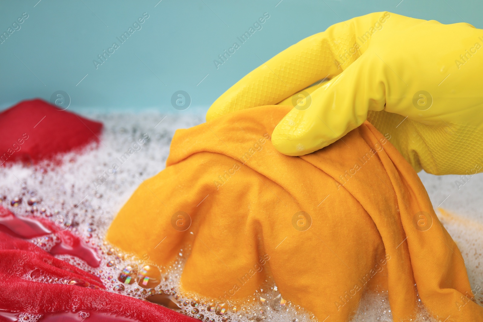 Photo of Woman washing garment in basin, closeup. Laundry