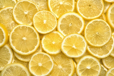 Slices of fresh juicy lemons as background