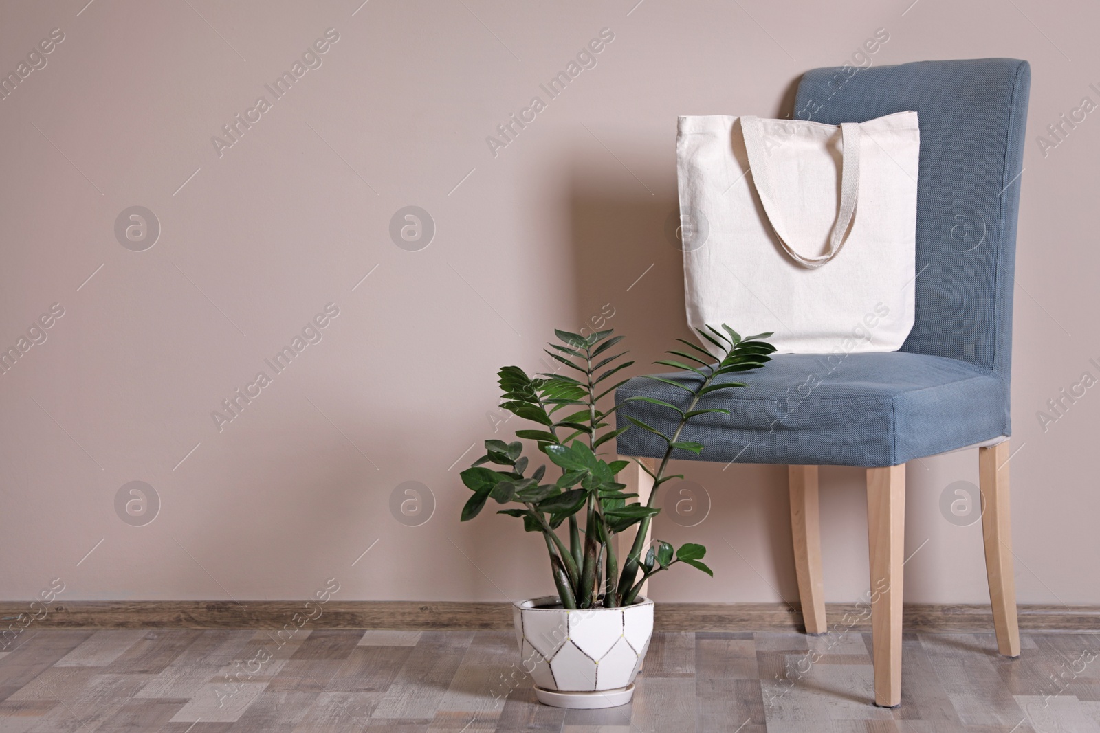 Photo of Eco tote bag in room interior. Space for design