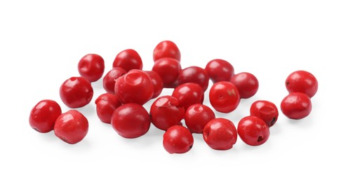 Aromatic spice. Many red peppercorns isolated on white