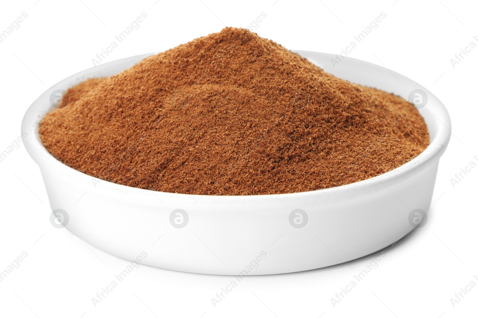 Photo of Plate of chicory powder on white background