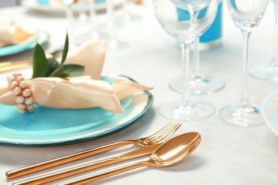 Photo of Beautiful table setting with cutlery, glasses, napkin and plate, closeup