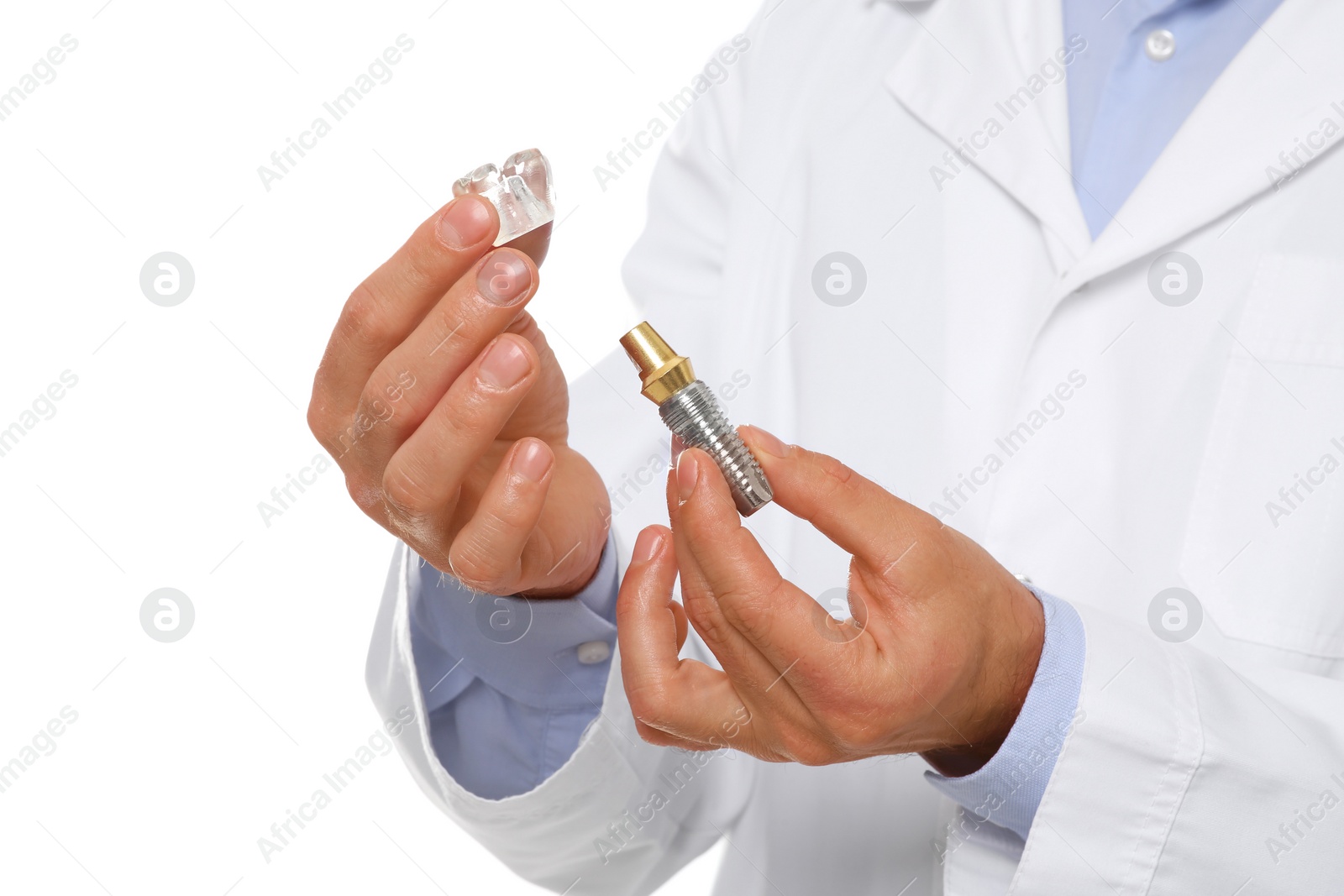 Photo of Dentist holding educational model of dental implant on white background, closeup