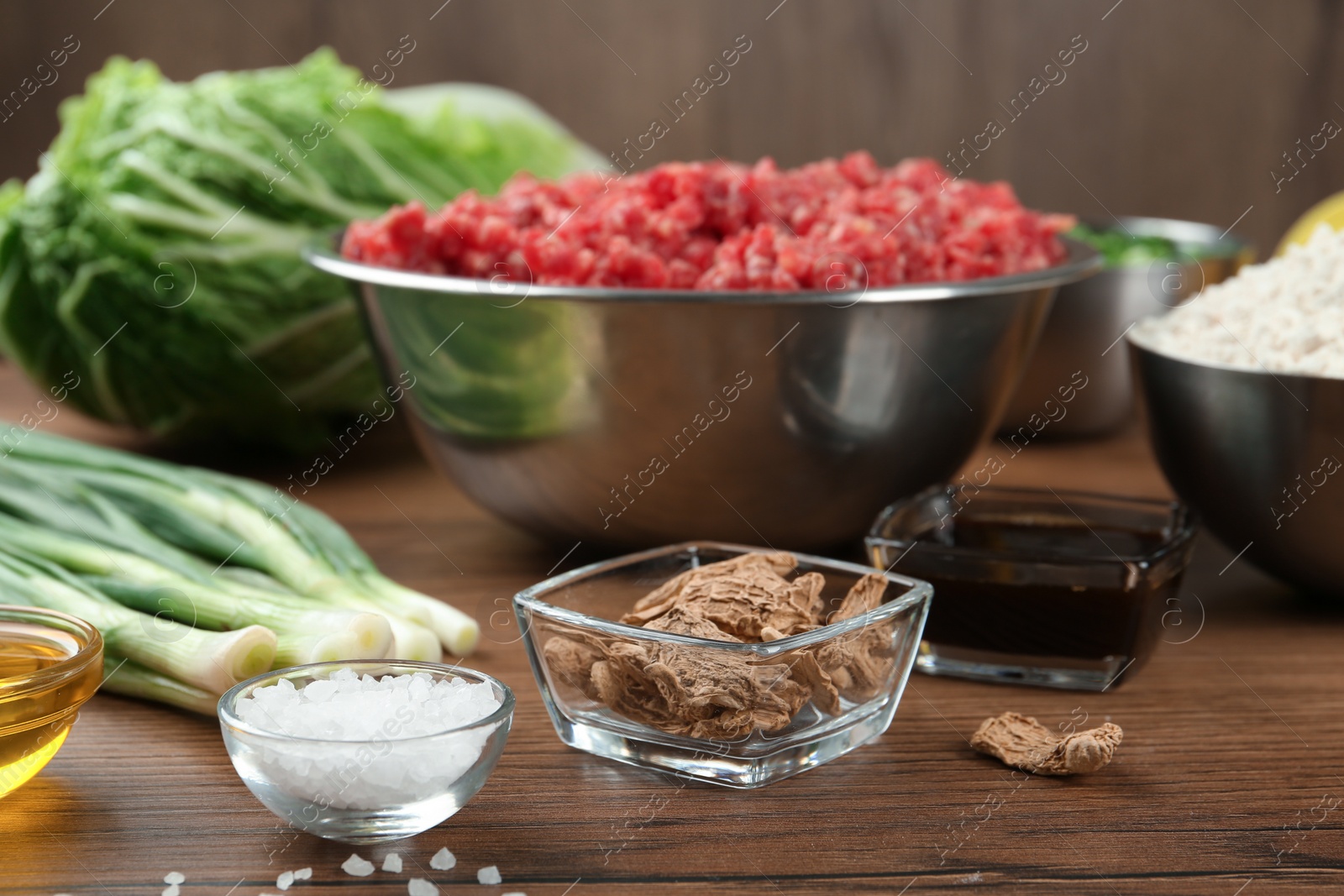 Photo of Composition with ingredients for gyoza on wooden table