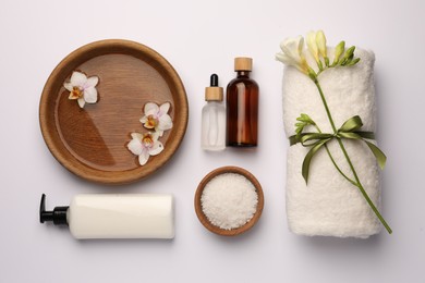 Flat lay composition with different spa products on white background