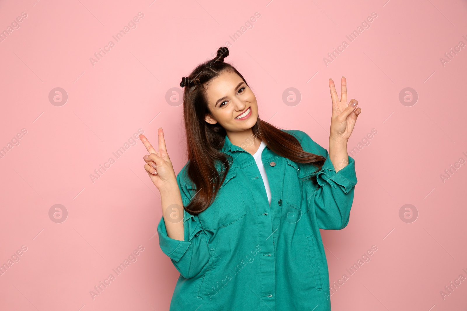 Photo of Portrait of beautiful young woman in stylish clothes on color background