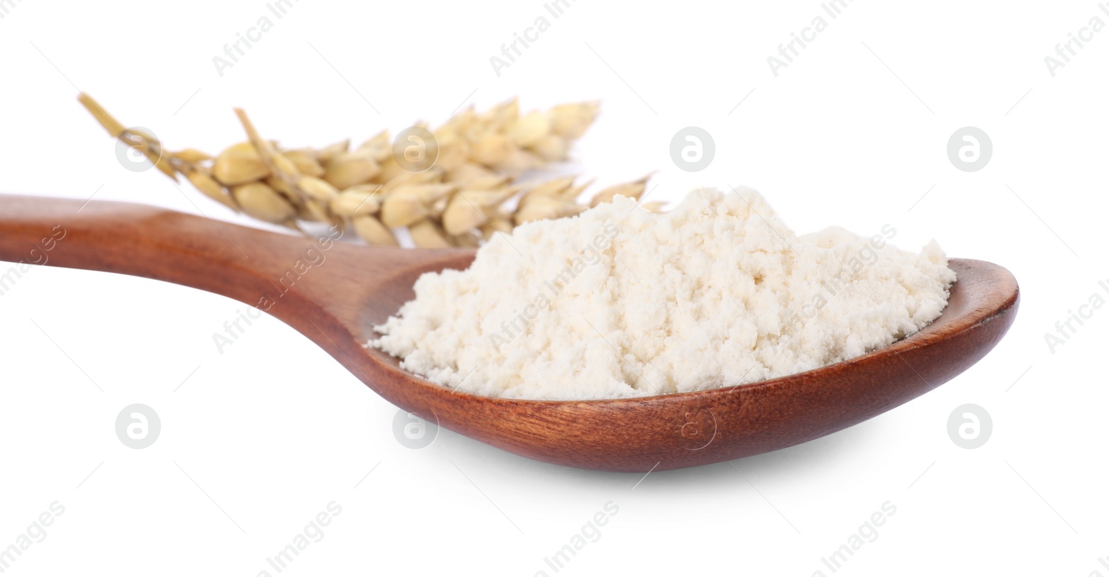 Photo of Spoon of wheat flour isolated on white