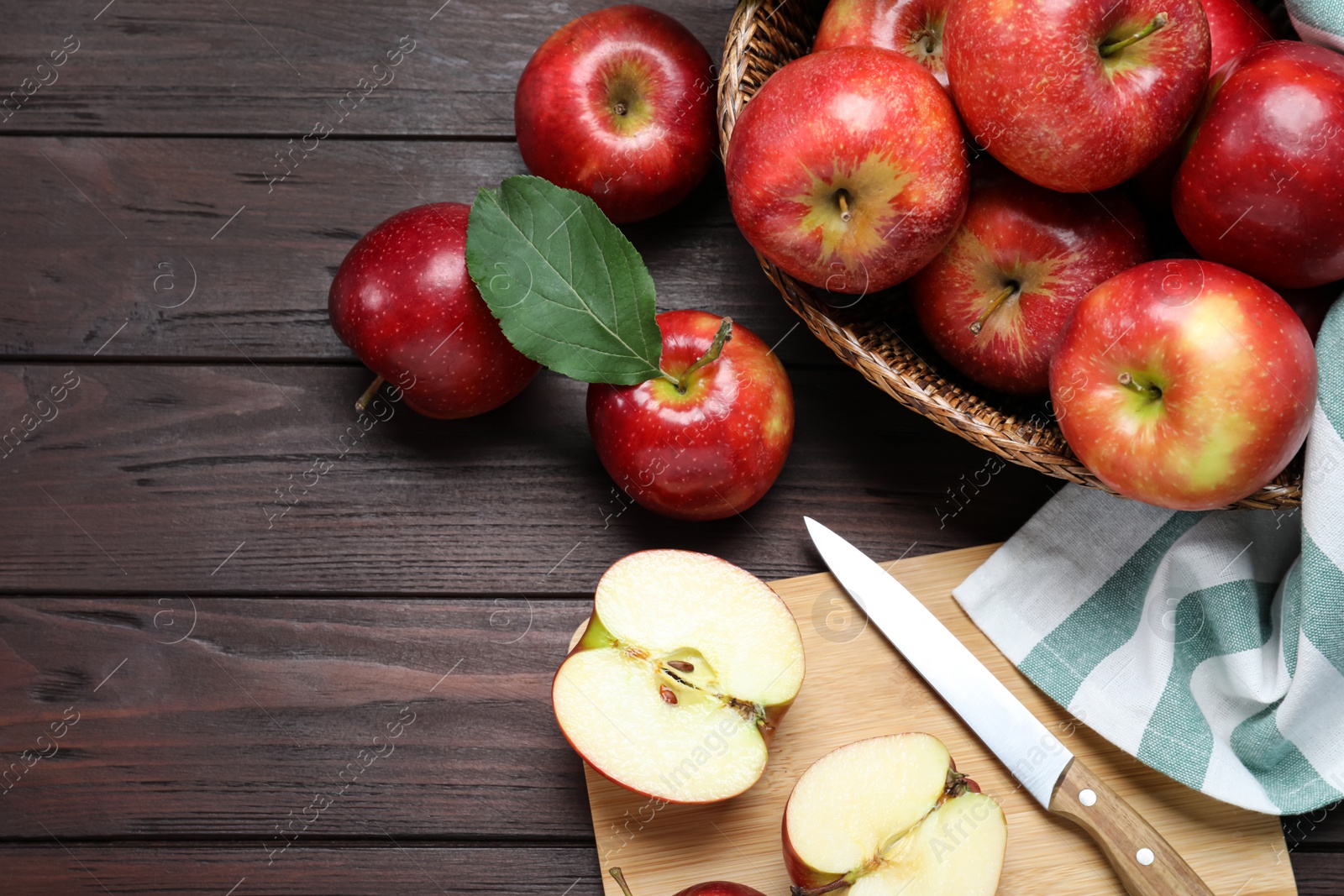 Photo of Flat lay composition with juicy red apples on wooden table
