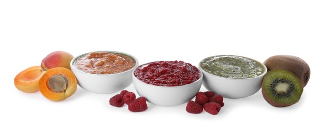 Photo of Different puree in bowls and fresh ingredients on white background