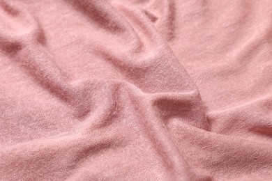 Photo of Texture of soft pink crumpled fabric as background, closeup