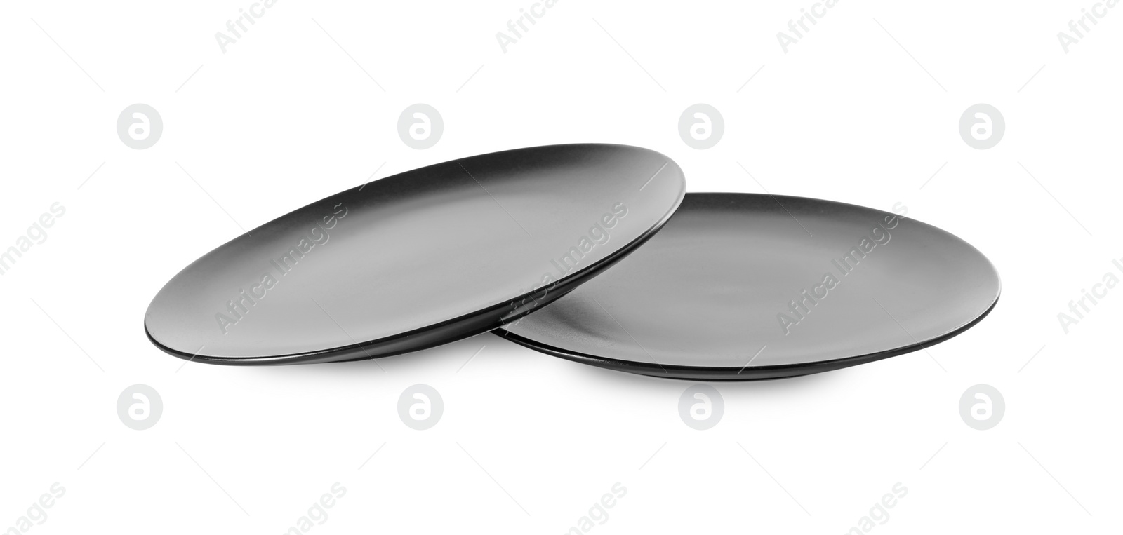 Photo of Two clean ceramic plates on white background