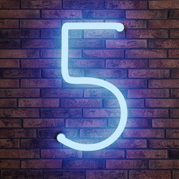 Image of Glowing neon number 5 sign on brick wall