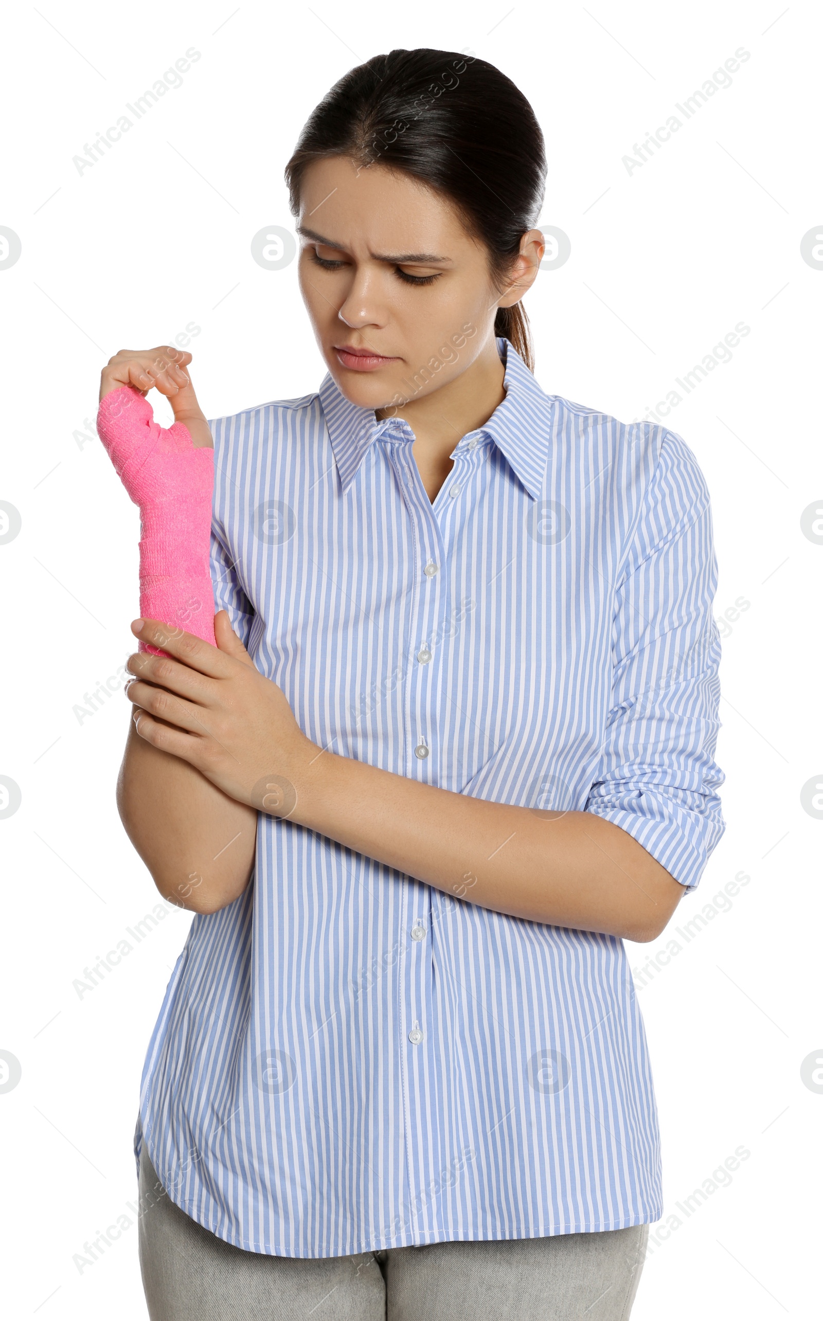 Photo of Young woman with hand wrapped in medical bandage on white background