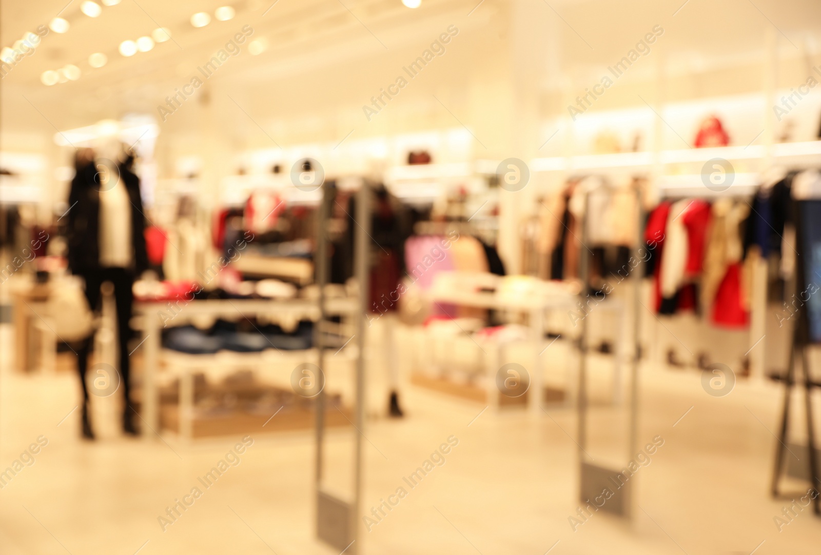 Photo of Blurred view of modern shopping mall interior. Bokeh effect