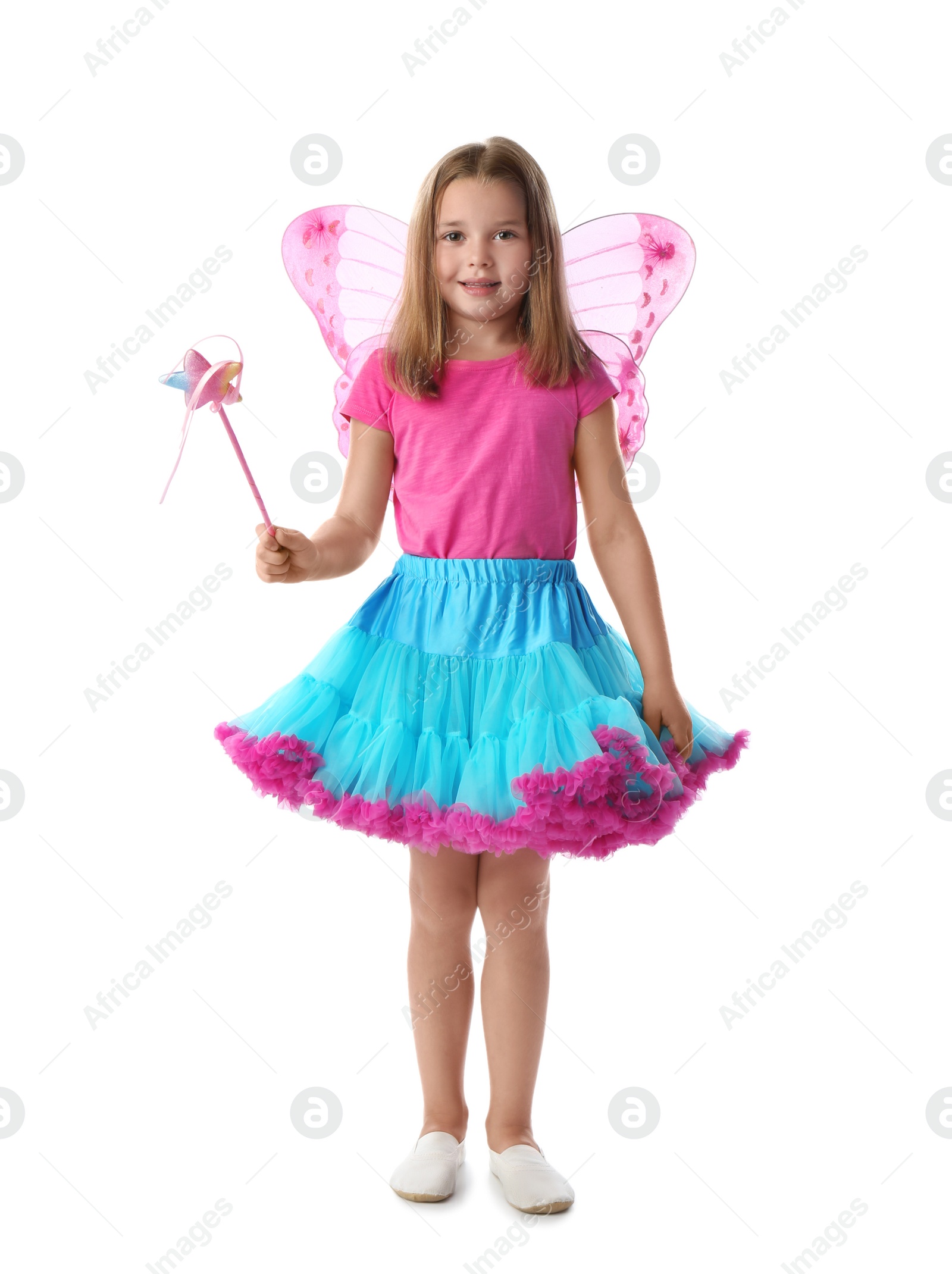 Photo of Cute little girl in fairy costume with pink wings and magic wand on white background