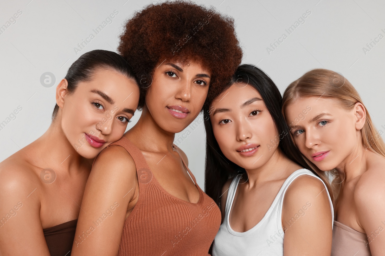 Photo of Portrait of beautiful young women on light grey background