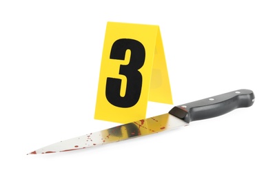 Photo of Bloody knife and crime scene marker with number three isolated on white
