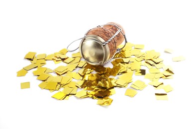 Photo of Cork of sparkling wine with muselet cap and shiny golden confetti on white background