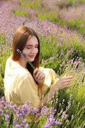 Young woman in lavender field on summer day