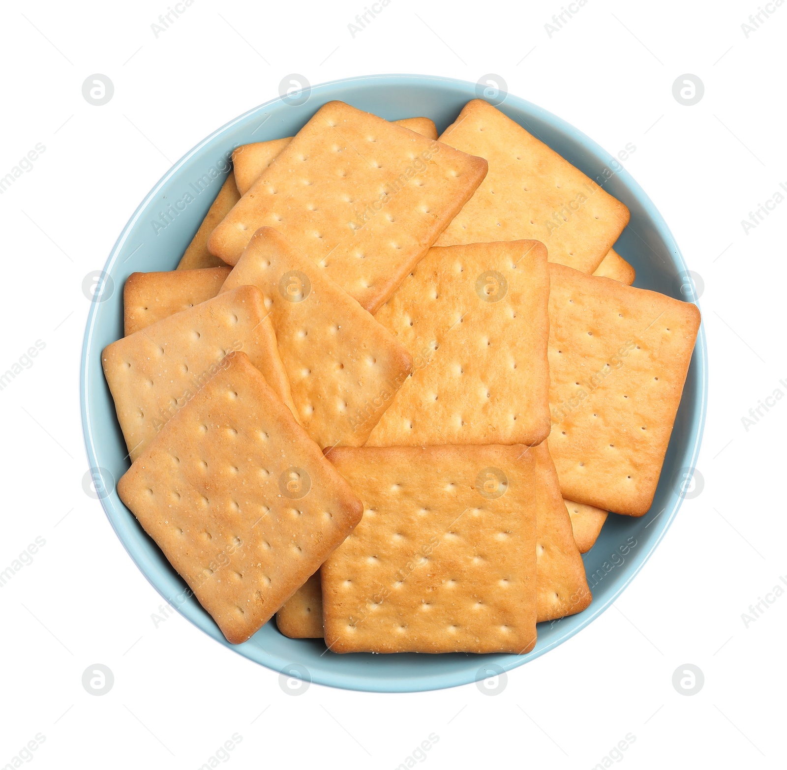 Photo of Tasty crackers in bowl isolated on white, top view