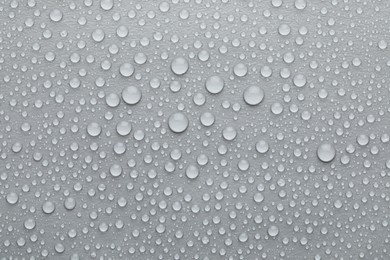 Photo of Water drops on grey background, top view