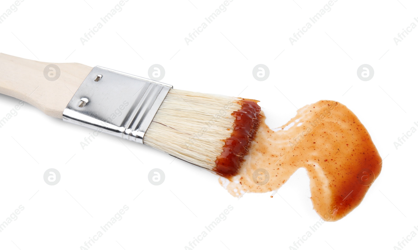 Photo of Marinade with basting brush isolated on white