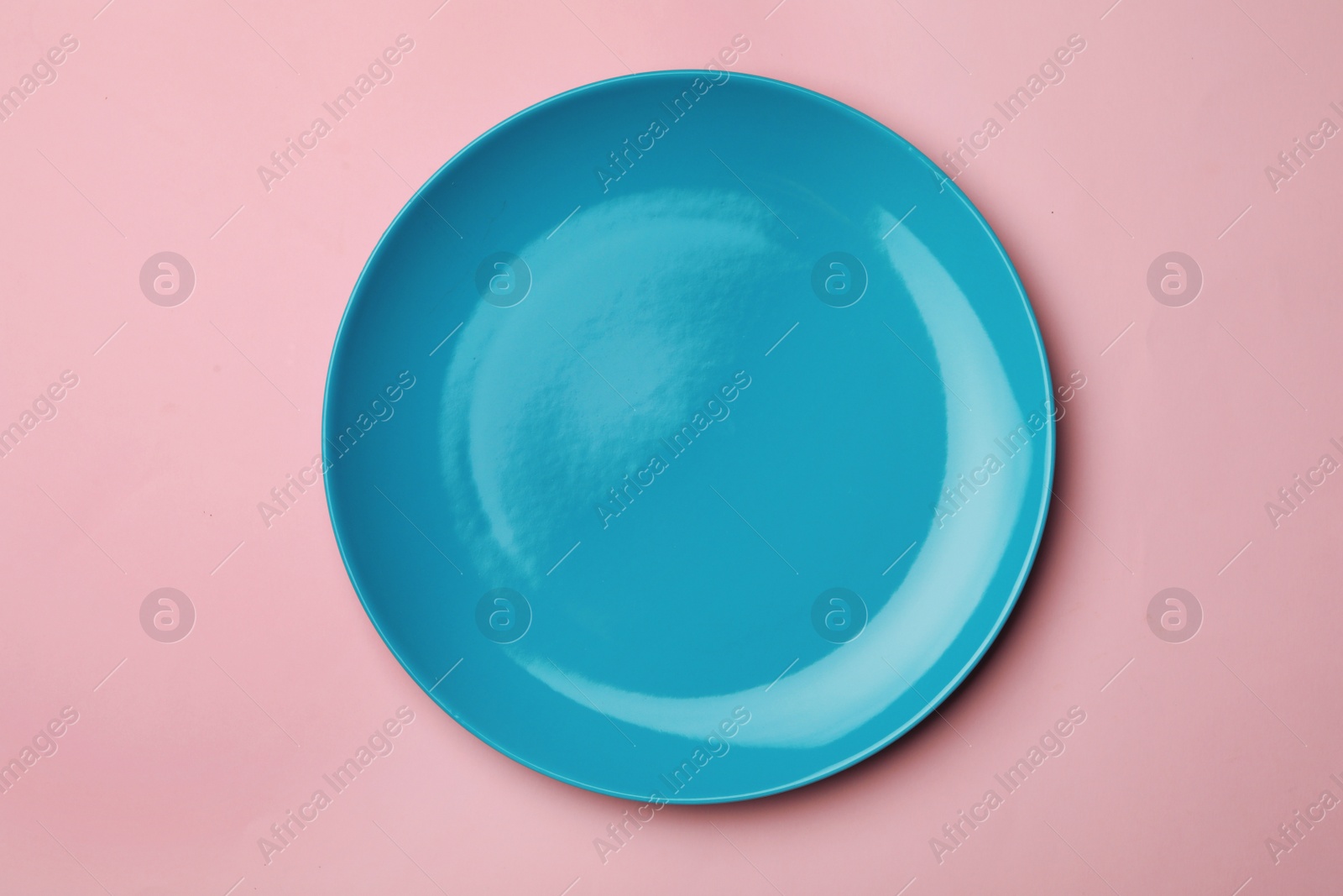 Photo of Clean empty plate on color background, top view