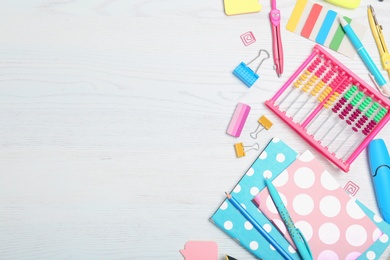 Photo of Flat lay composition with different school stationery on wooden background