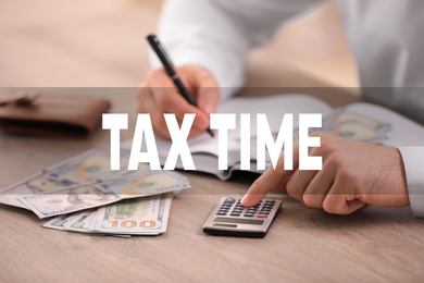 Tax accountant working with calculator and money at table, closeup