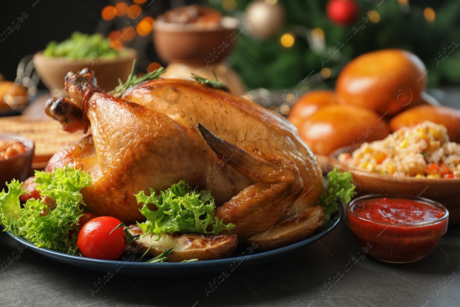 Photo of Traditional festive dinner with delicious roasted turkey served on table