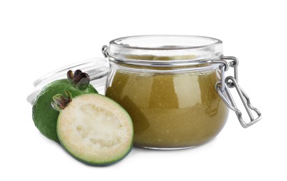 Photo of Feijoa jam in glass jar and fruits on white background