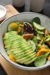 Photo of Healthy dish high in vegetable fats in bowl on table, closeup