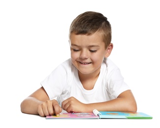 Photo of Cute little boy reading book on white background
