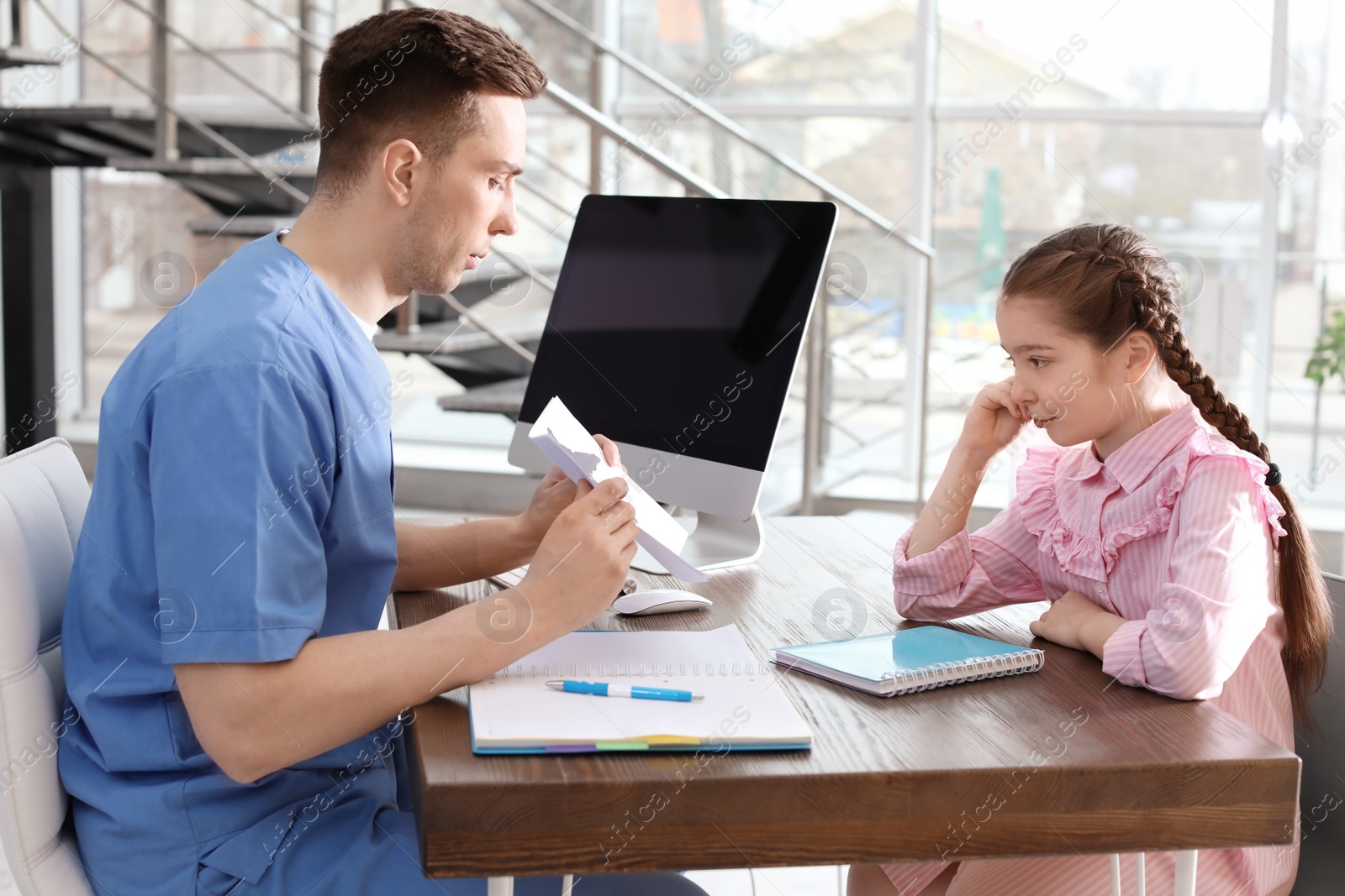 Photo of Little girl passing Rorschach test at child psychologist office