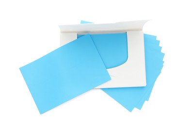 Photo of Package of facial oil blotting tissues on white background, top view. Mattifying wipes