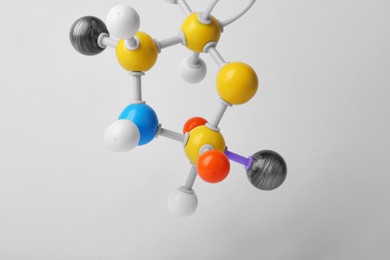 Structure of molecule on white background, closeup. Chemical model