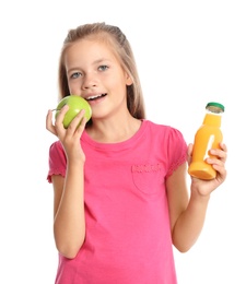 Photo of Happy girl holding apple and bottle of juice on white background. Healthy food for school lunch