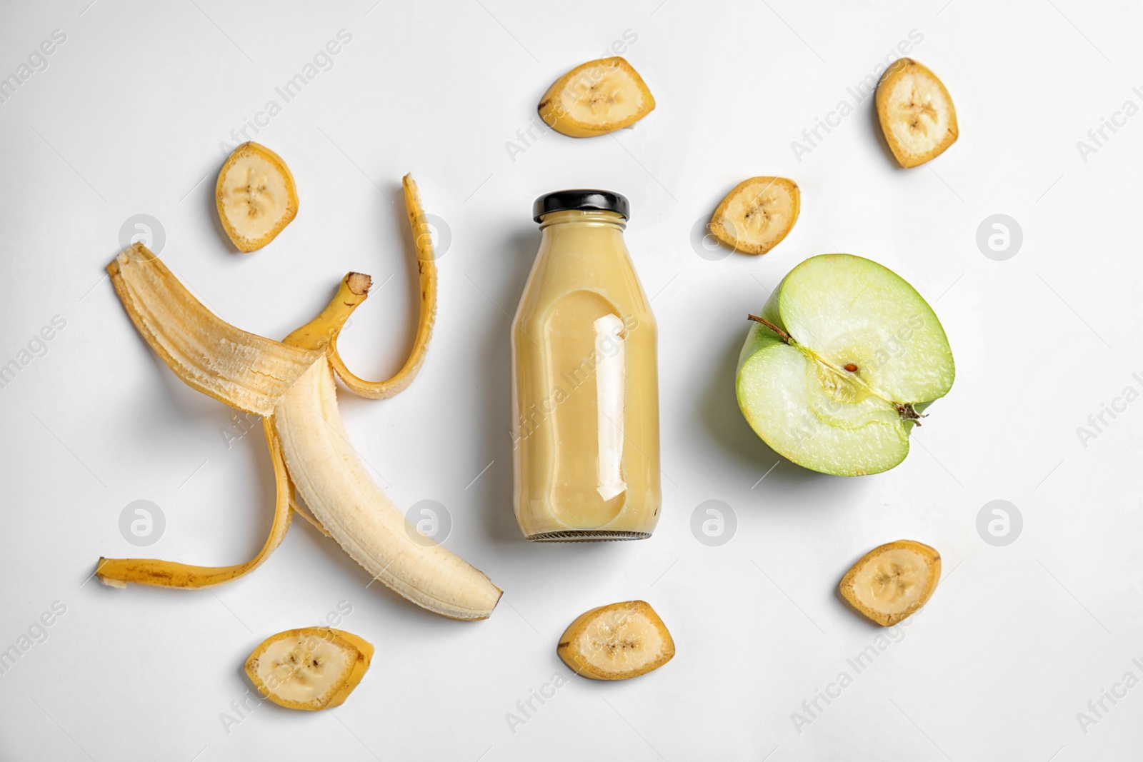 Photo of Flat lay composition with bottle of juice on white background