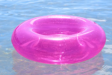 Photo of Bright inflatable ring floating on sea water