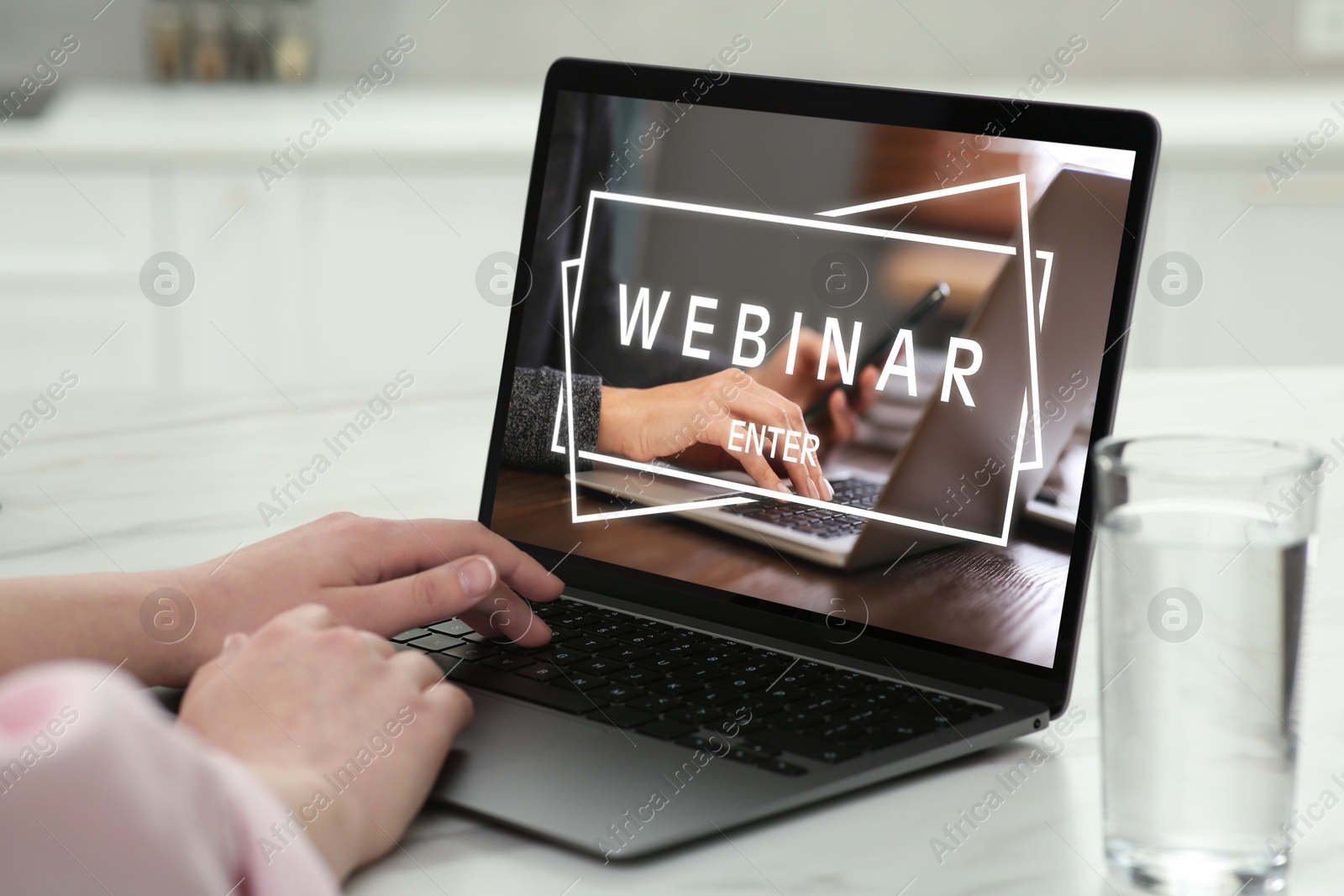 Image of Webinar. Woman using laptop at table, closeup